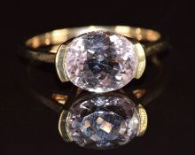A 9ct gold ring set with an oval cut morganite, 2.9g, size P