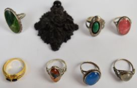 Six silver rings including Arts & Crafts moonstone, Navajo turquoise, agate etc, a gold plated