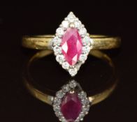 An 18ct gold ring set with a marquise cut ruby surrounded by diamonds (one missing), 3.7g, size N