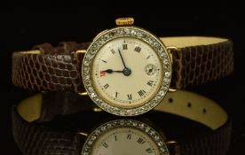 Swiss 18ct gold ladies wristwatch with diamond set bezel, subsidiary seconds dial, blued hands,