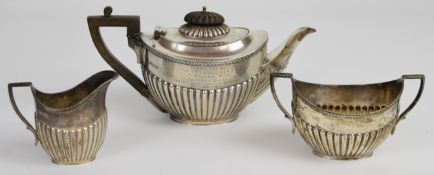 Edward VII hallmarked silver bachelor's tea set with fluted lower bodies and gadrooned edges,