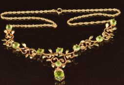 A 9ct gold necklace set with peridot with foliate decoration, 14g, 44cm