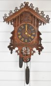 19th/ 20th century cuckoo clock with pierced and carved decoration, overall height of clock 53cm