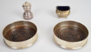 Pair of Elizabeth II feature hallmarked silver wine bottle coasters, London 1987, maker David R