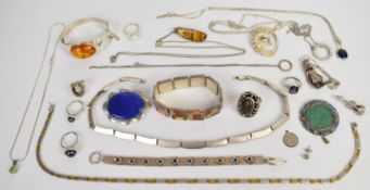 A collection of silver jewellery including five rings, one by Kurt Jobst, bracelet and bangle set