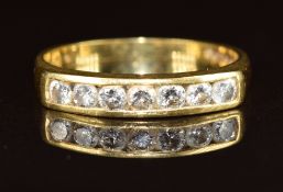 An 18ct gold ring set with seven diamonds, the total diamond weight approximately 0.3ct, 3.1g,