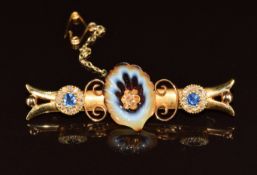 A 22ct gold and 9ct gold brooch set with banded agate carved in the form of a shell, rose cut