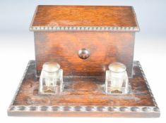 A 19th/20thC oak standish / stationery box with fitted interior and twin glass inkwells, W27 x D22 x