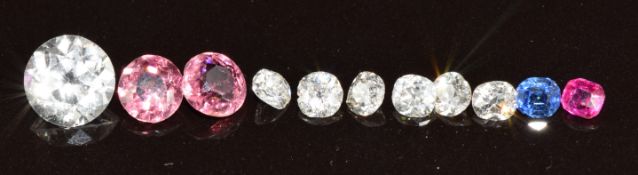 A collection of loose gemstones comprising six diamonds (1.4ct total), ruby (0.2ct), sapphire (0.