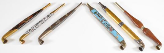 Six opium pipes including inlaid and cloisonné examples, longest 14.5cm