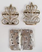 Two Victorian hallmarked silver nurse's belt buckles comprising one with scrolling design,