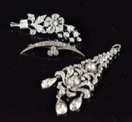 A silver pendant set with foiled paste (7.5cm) and two silver brooches set with paste