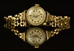 Accurist 9ct gold ladies wristwatch with gold hands and Arabic numerals, silver dial and signed 21
