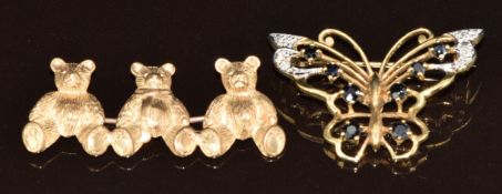 Two 9ct gold brooches, one in the form of three Teddy bears and the other a butterfly set with