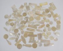 Approximately one hundred Chinese 19thC mother of pearl engraved and pierced gaming counters,