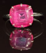 An 18ct white gold ring set with a synthetic ruby, 3.6g, size Q