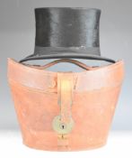 Cuthbertson silk top hat in lined leather case, size 7 or 22½ inches