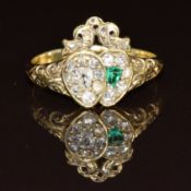 Victorian ring in the form of two hearts set with an emerald and an old cut diamond surrounded by