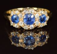 A c1910 18ct gold ring set with three round cut sapphires of approximately 0.4, 0.15 & 0.15ct