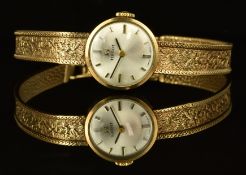 Tissot 9ct gold ladies wristwatch with two-tone hands and baton hour markers, silver dial and signed