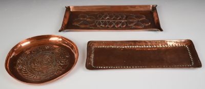Three Arts and Crafts copper dishes including one Keswick School of Industrial Arts and another