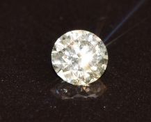 A loose 0.30ct round brilliant cut very light brown diamond, with GIA certificate