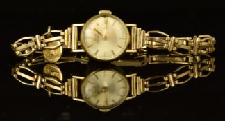 Girard-Perregaux ladies wristwatch with gold hands and hour markers, silver dial. gold plated case