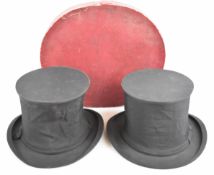 Two collapsible 'opera' top hats by Henry Heath and Dunn, sizes 6⅞ or 22⅛ inches and 7 or 22½