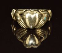 A c1900 9ct gold ring in the form of two hands set with a seed pearl and turquoise and with a