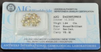 Forty natural light yellow-orange-brown round brilliant cut diamonds, each measuring 2.15-2.24mm,