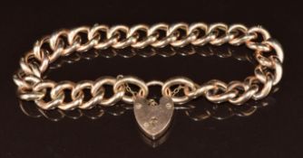 A 9ct rose gold curb link bracelet with heart padlock clasp, 19.6g, 18cm