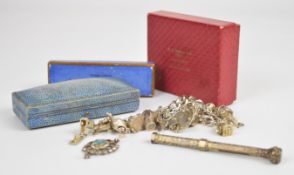 A silver charm bracelet with fifteen charms including dog, car, church, Concorde by Chim, etc (80g),