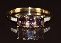 A 9ct gold ring set with three oval cut topaz and diamonds, 2.5g, size P