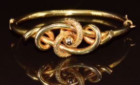 Victorian 9ct gold bangle in a lover's knot design, 10.5g, 6 x 4.5cm