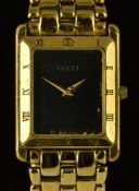 Gucci gentleman's wristwatch ref. 4200 M with gold dauphine hands, black dial, Roman numerals to the