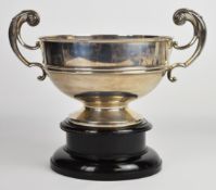 Walker & Hall George V hallmarked silver twin handled trophy cup or bowl, on ebonised base,
