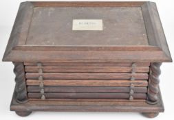 Oak coin collector's chest of five drawers with fitted interiors to accommodate approximately one