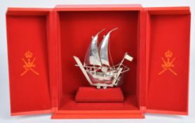 Cased Chinese or similar silver model of a sailing ship or junk, marked to rudder 925, height of