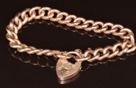 A 9ct rose gold curb link bracelet with heart padlock clasp, Birmingham 1909, 19.2g, 18cm