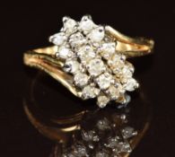 A 14k gold ring set with diamonds in a cluster, 4.5g, size N