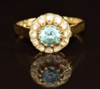An 18ct gold ring set with zircon surrounded by spinel, 3.2g, size L