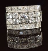 An 18ct gold white gold ring set with round cut diamonds, the centre diamond 0.54ct, the total