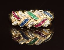 A 14k gold ring set with emerald, sapphires, rubies and diamonds in a foliate design, 3.5g, size O