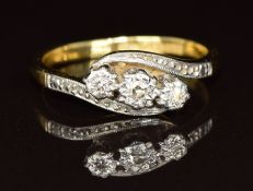 An 18ct gold ring set with three diamonds in a platinum setting, 3.1g, size J