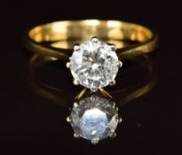 An 18ct gold ring set with a round cut ring set with a round brilliant cut diamond of