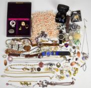 A collection of costume jewellery including Kenneth Cole watch, silver pendant, Skagen watch, 9ct