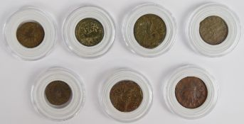 A collection of seven largely radiate head bronze Roman Imperial coinage including Romulus and