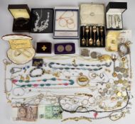 A collection of costume jewellery including silver gate bracelet, cufflinks, coins, book vesta,