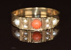 A 9ct gold ring set with a coral cabochon and seed pearls, 2.2g, size O