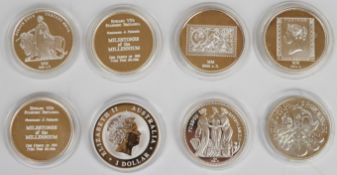 Eight one ounce fine silver coins/medallions comprising six milestones of the millennium, 2012